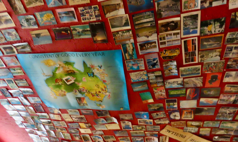 THe shop ceiling decorated with postcards
