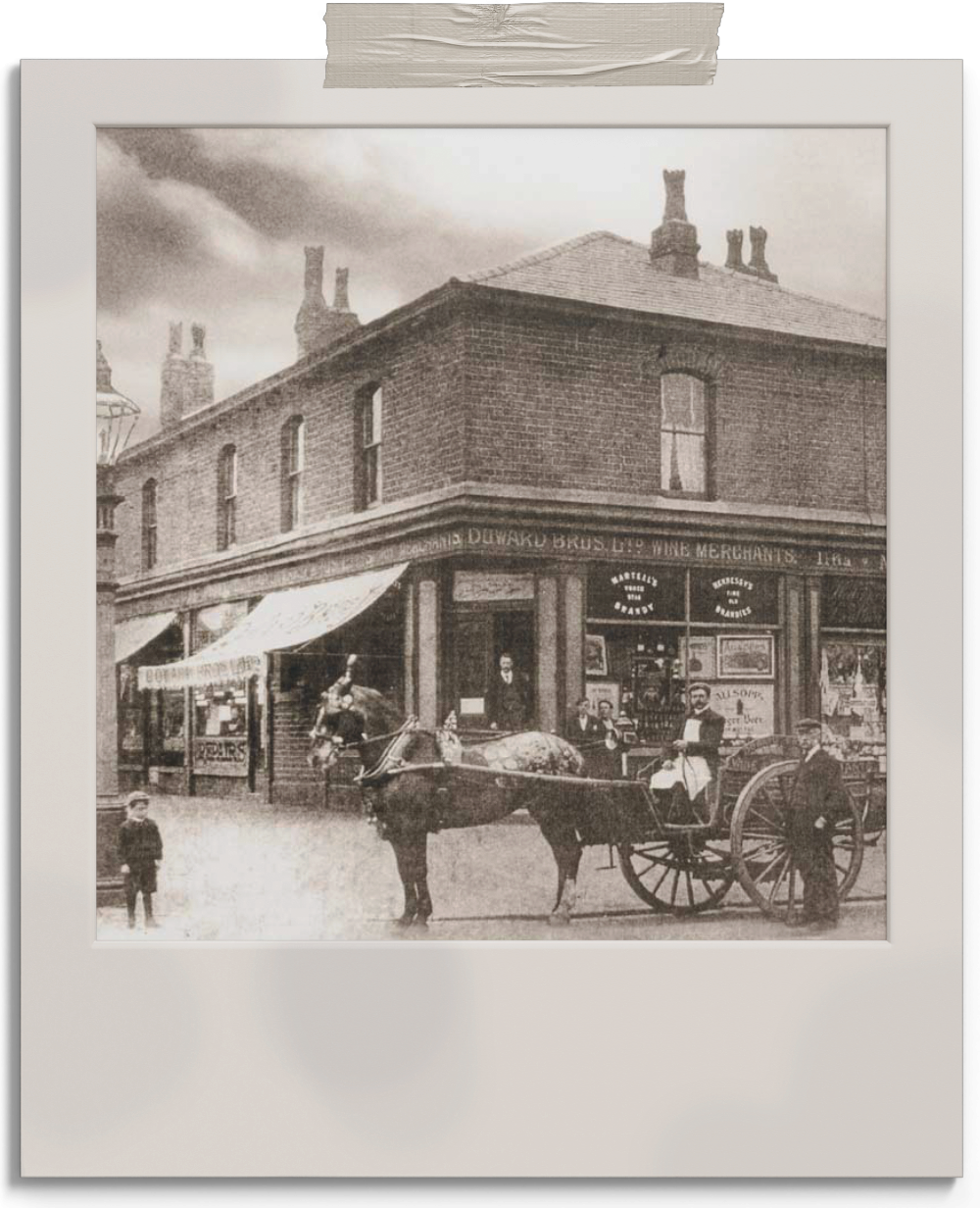 Black and white photo of the shop in the early 1900s